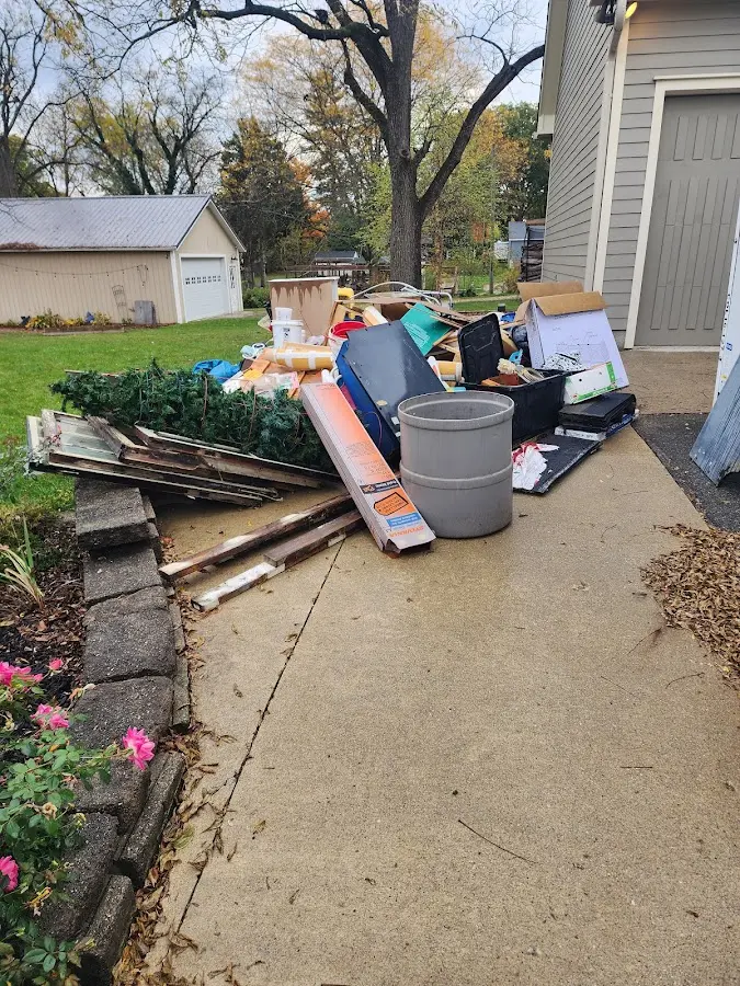 Dumpster being loaded with debris for 10 Yard Dumpster Rental in Fort Wright